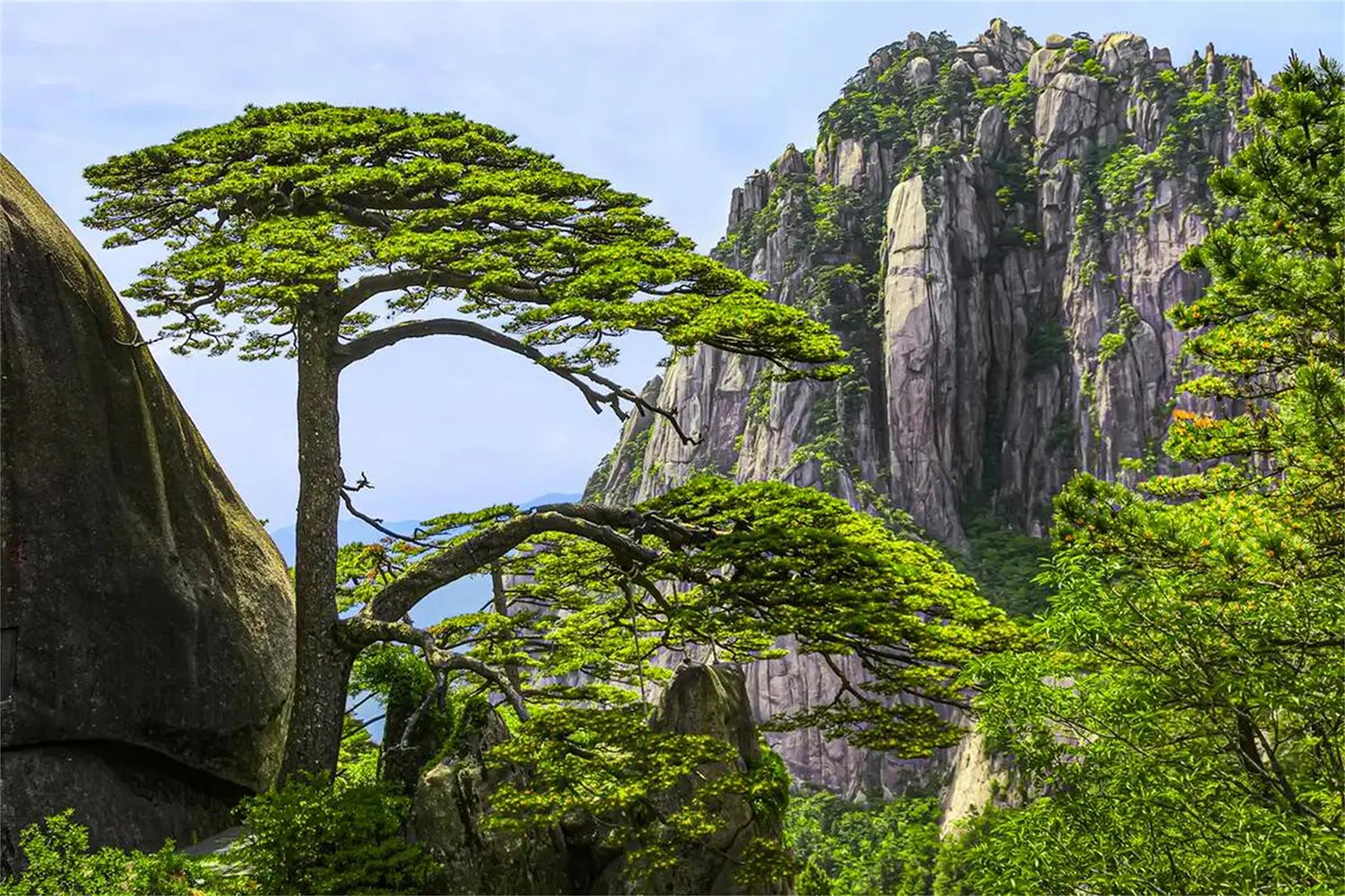 Misty mountain ridges rising above a valley